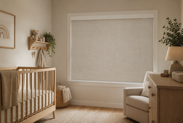 Motorized blackout roller shade in a neutral modern nursery