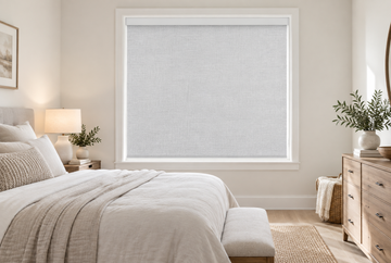 Blackout roller shades in a modern neutral bedroom