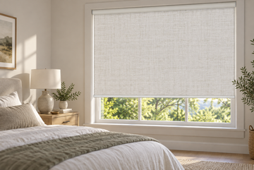 Blackout blinds controlling morning light in a modern bedroom